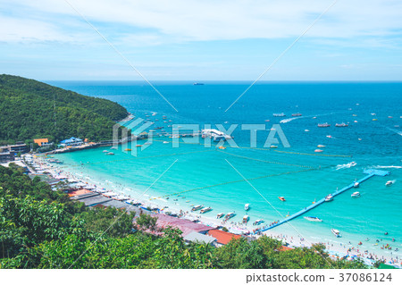 beautiful beach with tourists and harbor. beautiful beach with tourists and harbor. 37086124