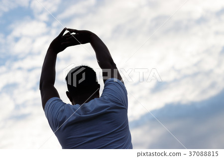 Young man warming up outdoors. Young man warming up outdoors. 37088815