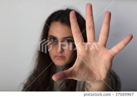 Abused woman stretching out her spread hand 37089967