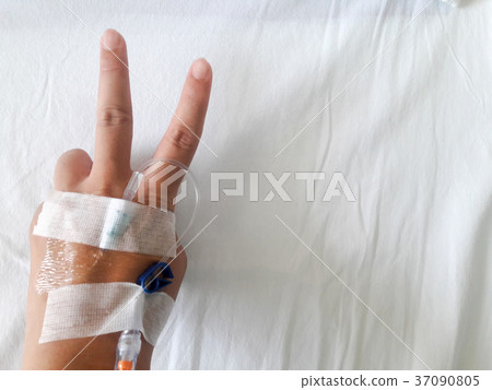 Patient hand with V sign and tube infusion 37090805
