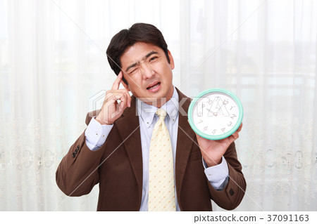 A businessman with a tired expression 37091163