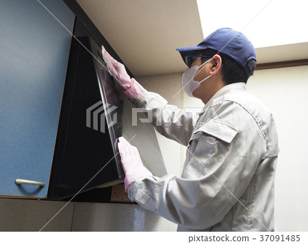 Worker cleaning oil dirty fan cover Worker cleaning oil dirty fan cover 37091485