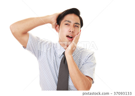 A tired businessman A tired businessman 37093133