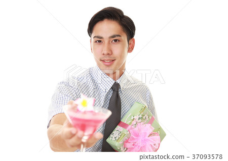 A smiling man with a present A smiling man with a present 37093578