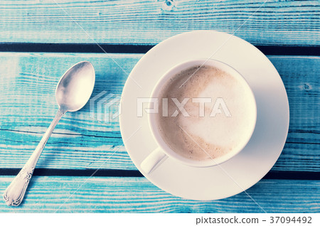 frothy coffee - cappuccino in a white mug frothy coffee - cappuccino in a white mug 37094492