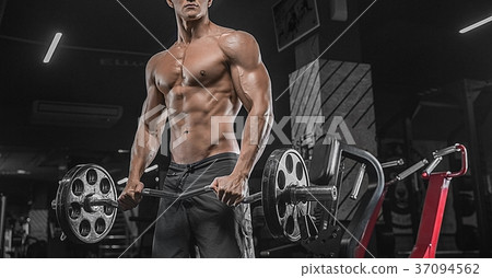 A close portrait of a muscular male weight-lifting 37094562