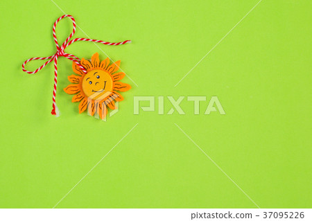 Bulgarian Martenitsa and sun on green background 37095226