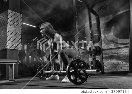 beautiful girl bodybuilder , execute exercise with dumbbells, in 37097184