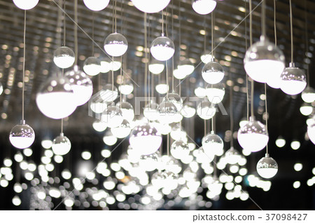 Concept lighting , Light bulb in a dark place. 37098427