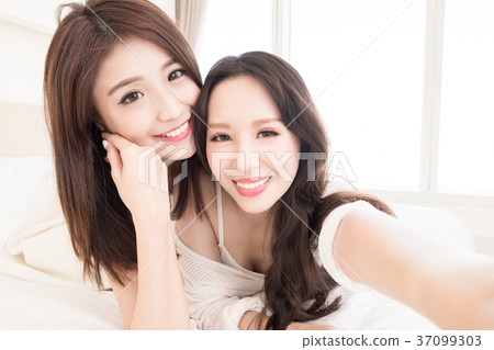 two beauty woman selfie happily two beauty woman selfie happily 37099303