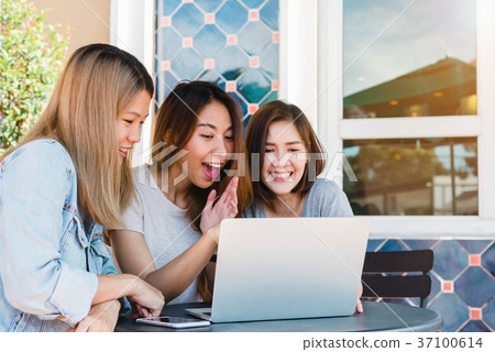 Asian women friends watching media content. 37100614