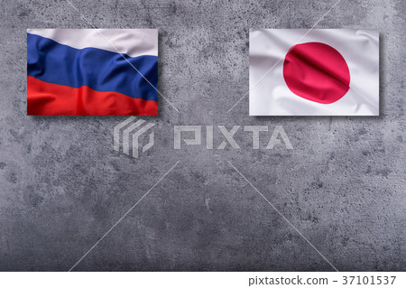 Russia and Japan flag on concrete background. 37101537