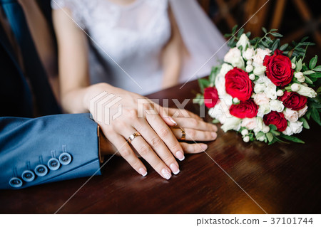 bride and groom in a cafe. wedding bouquet of bride and groom in a cafe. wedding bouquet of 37101744