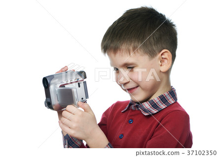 Little boy with video camera isolated Little boy with video camera isolated 37102350