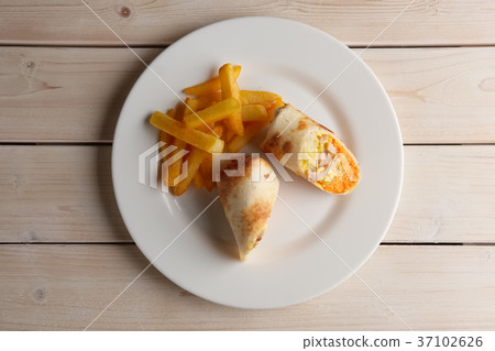 Meat, carrot, cabbage and cheese rolled in pitta Meat, carrot, cabbage and cheese rolled in pitta 37102626