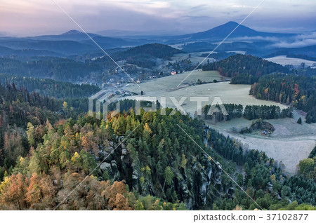 View of autumn landscape with meadows and forest 37102877