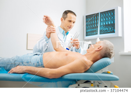 Delighted nice doctor doing his job 37104474