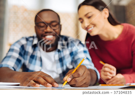 Two happy male and female colleagues projecting 37104835