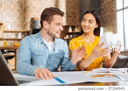 Two  joyful male and female colleagues  planni 37104945