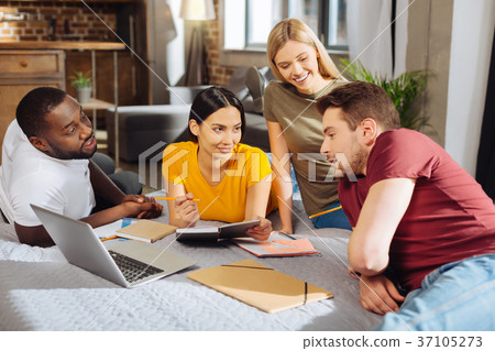 Four pensive energetic students preparing for 37105273