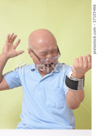 Surprised senior measuring blood pressure Surprised senior measuring blood pressure 37105466