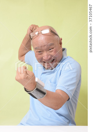 Surprised senior measuring blood pressure Surprised senior measuring blood pressure 37105467