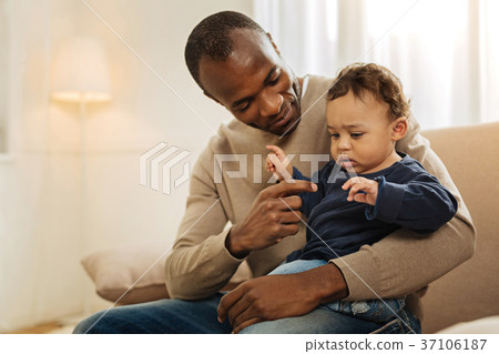 Alert man playing with his child 37106187