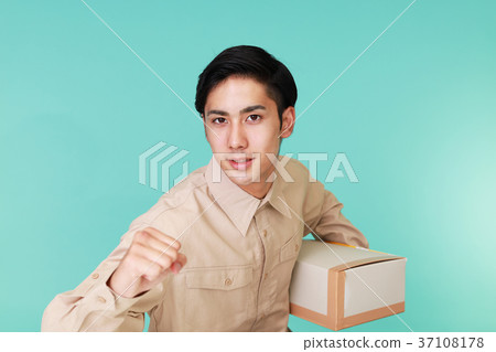 A man with a smile carrying baggage 37108178