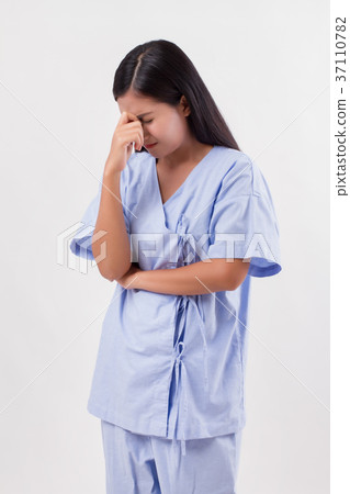 stressed woman patient suffering from headache, pain 37110782