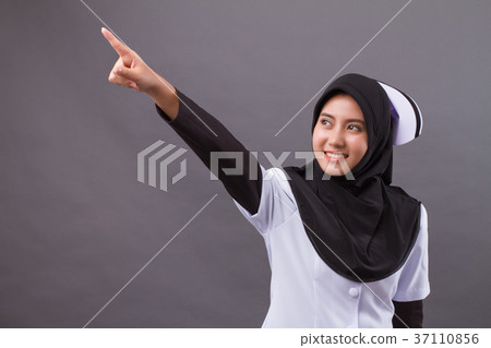 muslim nurse pointing up finger muslim nurse pointing up finger 37110856