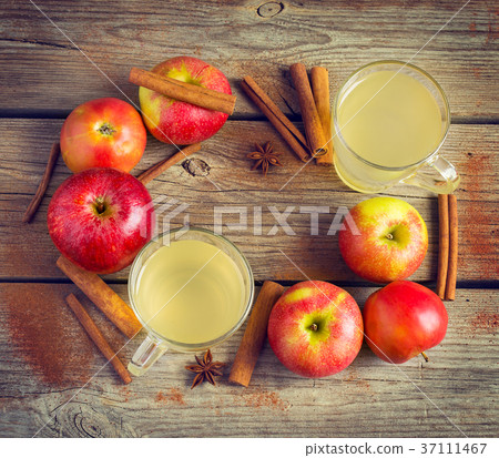 Organic Apples, cinnamon and glasses of cider  37111467
