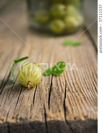 Fresh gooseberries on wooden background Fresh gooseberries on wooden background 37111537