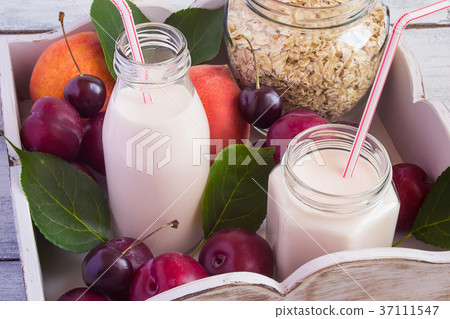 Healthy eating concept: bran, wheat germ, yogurt Healthy eating concept: bran, wheat germ, yogurt 37111547