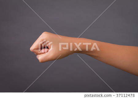 punching woman hand studio isolated 37112478