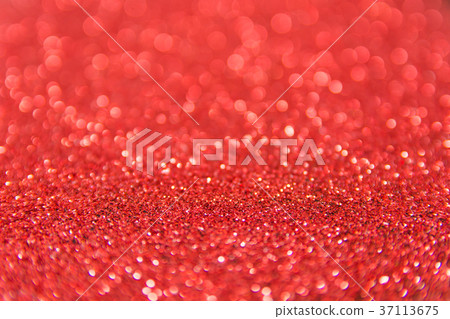 Red glitter defocused texture background. Red glitter defocused texture background. 37113675