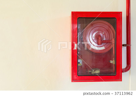 Fire extinguisher and fire hose reel on wall Fire extinguisher and fire hose reel on wall 37113962