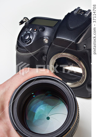 Photographer with big lens and SLR camera Photographer with big lens and SLR camera 37114708