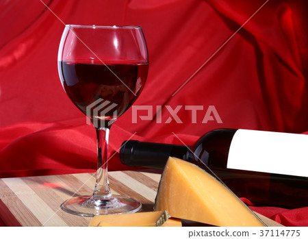Bottle and Glass with red wine grapes and chees Bottle and Glass with red wine grapes and chees 37114775