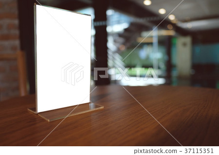 Mock up Menu frame standing on wood table in  37115351