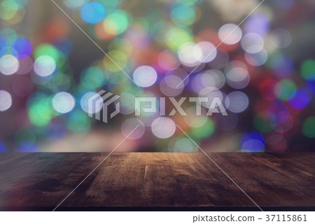 Empty wooden table in front of abstract bokeh Empty wooden table in front of abstract bokeh 37115861