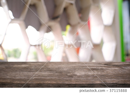 Empty wooden table in front of abstract blurred  37115888