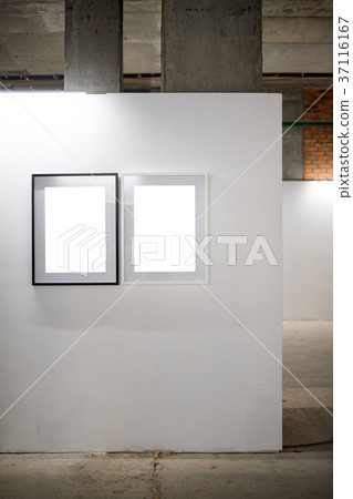 Mock up. Blank picture frames on white wall Mock up. Blank picture frames on white wall 37116167
