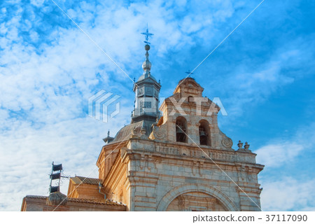 A view to an old decorated bell tower of an ancien 37117090