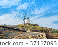 Old white traditional windmill on the hill near  37117093