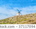 Old white traditional windmill on the hill near 37117094