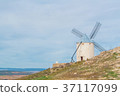 Old white traditional windmill on the hill near  37117099