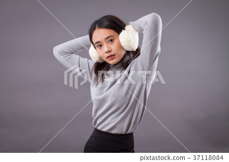 portrait of asian woman with earmuffs portrait of asian woman with earmuffs 37118084