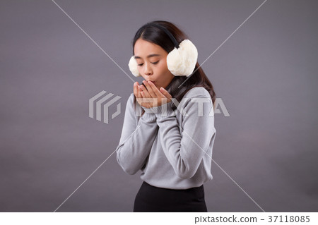 woman blowing her hand, warm up from cold weather 37118085
