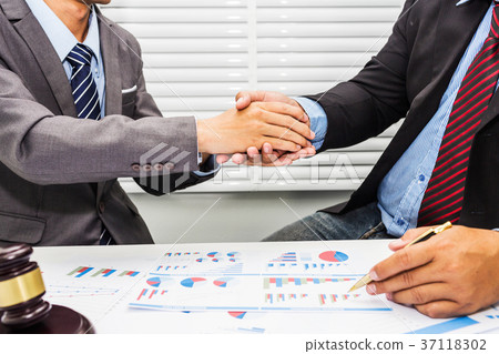 Handshake between lawyer and a male office worker 37118302