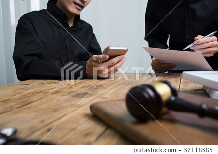 A team of lawyers legal advisers working together 37118385